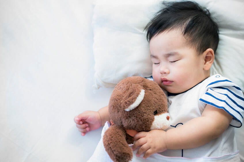 Newborn baby sleep with teddy bear